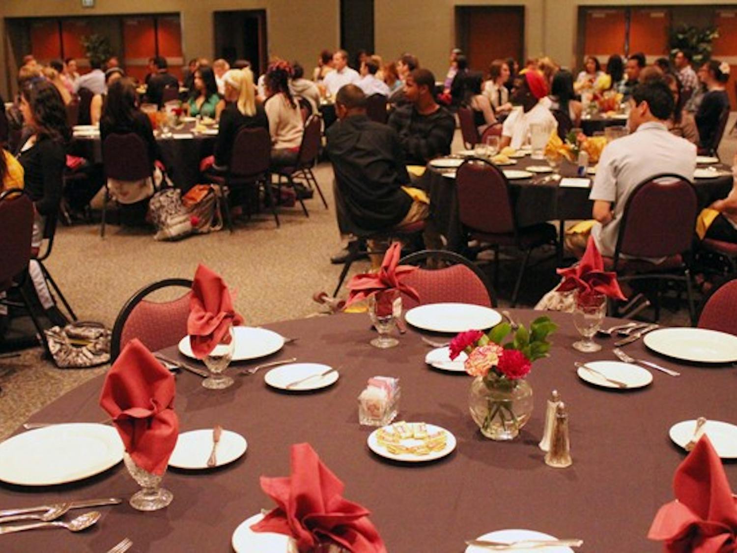 Barrett, The Honors College hosted a free dinner for students on the West campus Wednesday night. While they ate, Carol Bory gave guidance on proper etiquette during business meals. (Photo by Jenn Allen)