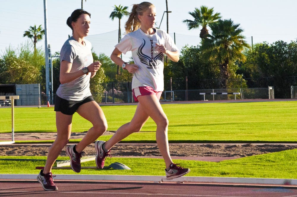 Junior Shelby Houlihan (left) and freshman Miranda Kewley (right) run sprints on the Joe Selleh Track. Houlihan brought home a national championship for the Sun Devils in the 1,500-meter race at the NCAA Championships in Eugene, Oregon. (Photo by Katie Dunphy)