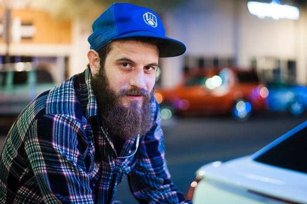 James Sydow of Milwaukee poses for a picture on his pedicab, Tuesday, Jan. 20, 2015 in downtown Phoenix. (Ben Moffat/The State Press)