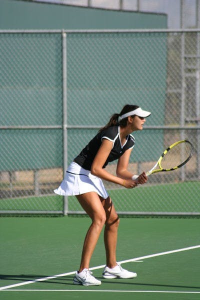 ARMED AND READY: Senior Nadia Abdala prepares for a forehand during the Sun Devils’ match against UC Davis in January. ASU begins Pac-10 play in Washington this weekend. (Photo by Kyle Thompson)