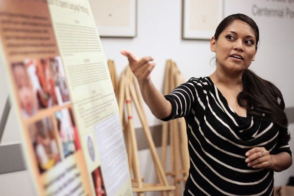 Wendi Lewis presents her poster addressing the need for speech language pathologists in the Salt River-Pima Maricopa Indian Community Thursday night in the Memorial Union. (Photo by Beth Easterbrook)