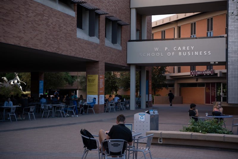 Students study under the Dean's Patio at the W. P. Carey School of Business in Tempe, Arizona. Taken Sept. 30, 2019.