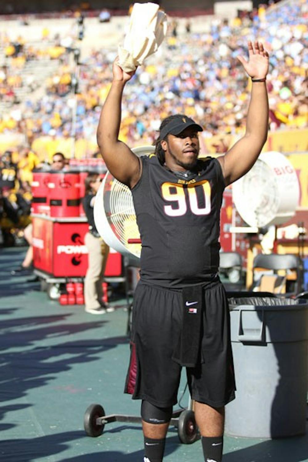 Redshirt junior defensive tackle Will Sutton cheers on his teammates from the ASU sideline during the Sun Devils’ 45-43 loss to UCLA on Oct. 27. (Photo by Kyle Newman)
