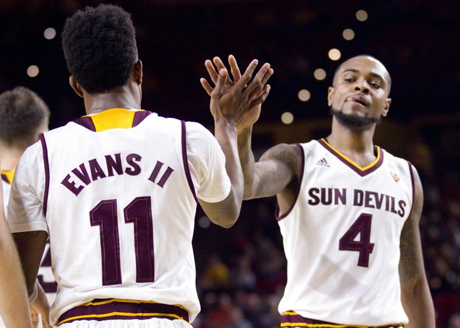 ASU junior guard Shannon Evans II (11) high-fives senior guard Torian Graham (4) after a play in the first half of a men's basketball game against the UNLV Runnin' Rebels in Wells Fargo Arena in Tempe, Arizona, on Saturday, Dec. 3, 2016. ASU won 97-73, putting them at 5-3 on the season.