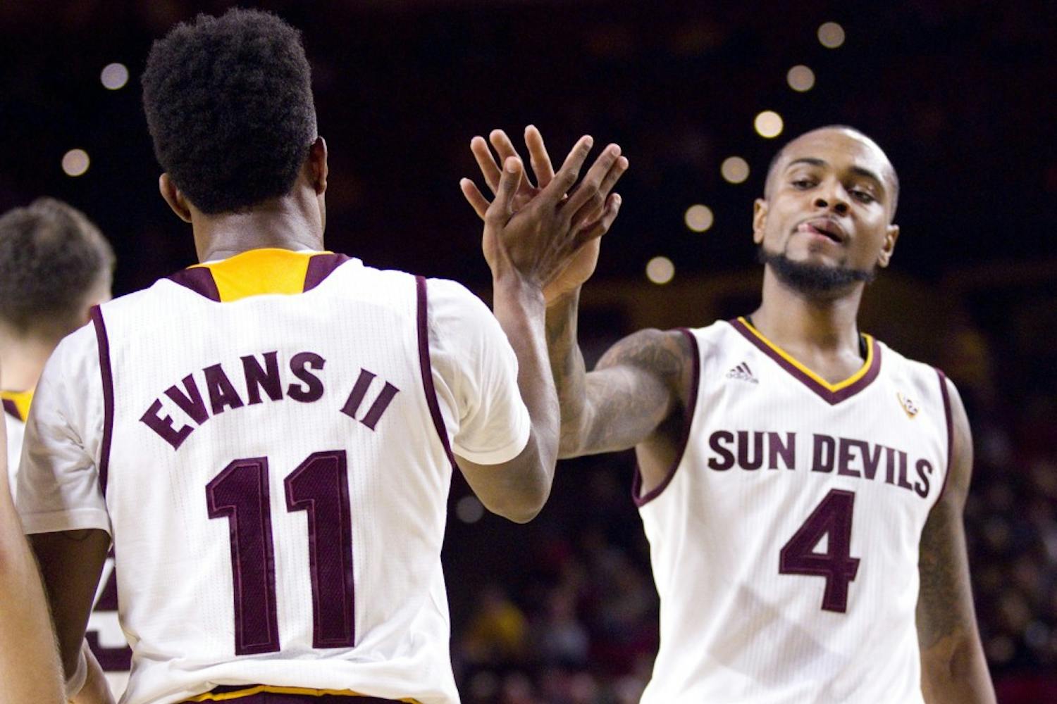 ASU junior guard Shannon Evans II (11) high-fives senior guard Torian Graham (4) after a play in the first half of a men's basketball game against the UNLV Runnin' Rebels in Wells Fargo Arena in Tempe, Arizona, on Saturday, Dec. 3, 2016. ASU won 97-73, putting them at 5-3 on the season.