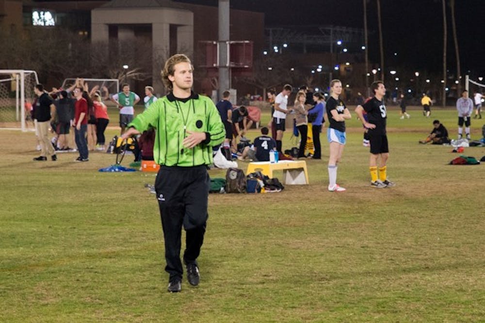 Intramural referee Daniel Oldmixon makes a call on a play at an intramural soccer game on Feb. 17. (Photo by Andrew Ybanez)