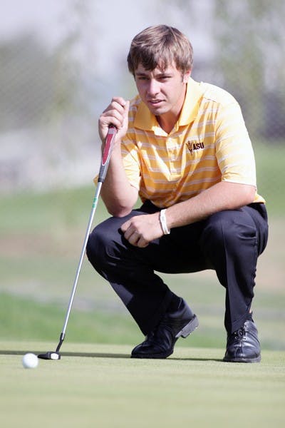 Freshman Austin Quick stares down a putt at practice Nov. 4, 2011. Quick made a hole-in-one on the second day of the Amer Ari Invitational. (Photo by Beth Easterbrook)(Photo by Beth Easterbrook)