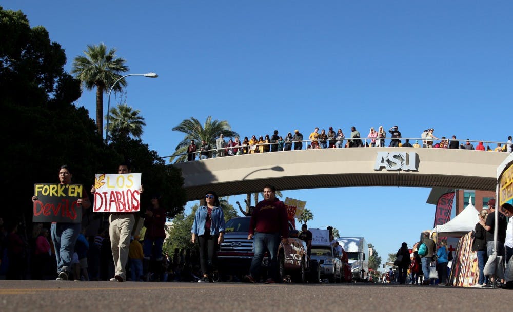 ASU students and alumni march down University Way during the 2015 Homecoming Parade before ASU football plays Washington on Saturday, Nov. 14, 2015.