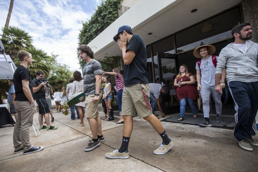 Church-goers walk out of Neeb Hall after a Hope Life Church service on the Tempe campus on Oct. 2, 2016. 