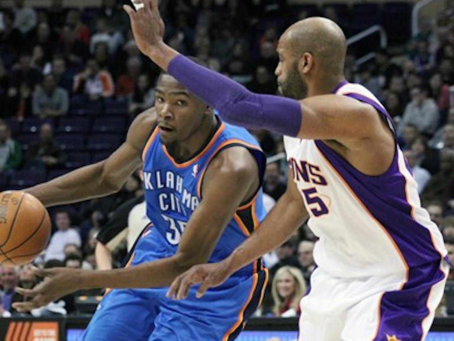 Oklahoma City small forward Kevin Durant drives inside against Suns’ guard Vince Carter during a game last season. Durant and the rest of the NBA’s stars are all back for the shortened 2011-12 season. (Photo by Beth Easterbrook)