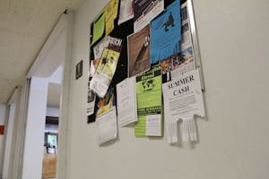 ODD JOBS: Billboards, such as ones at the Homer G. Language and Literature building, are filled with flyers for full- and part-time jobs for students who want to earn extra cash over the summer. (Photo by Nikolai de Vera)