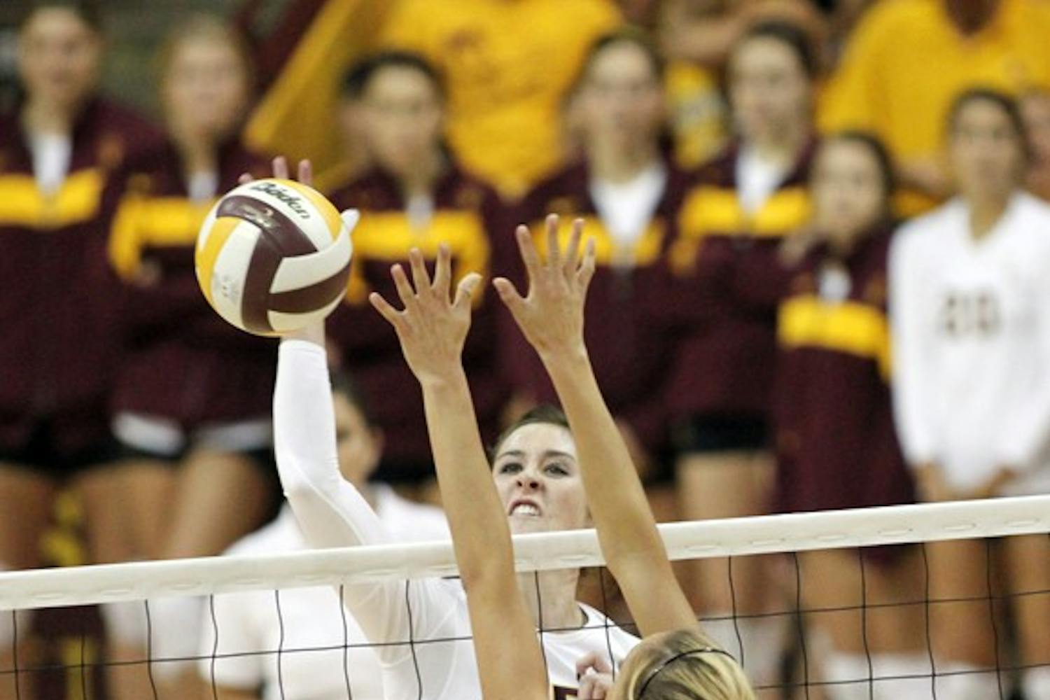 IMPACT: Sophomore middle blocker Alexis Pinson reaches for a spike during the Sun Devils’ 3-2 loss to Washington State on Friday. Pinson has emerged as a valuable “Seventh Man” for the ASU volleyball team this season. (Photo by Rosie Gochnour)