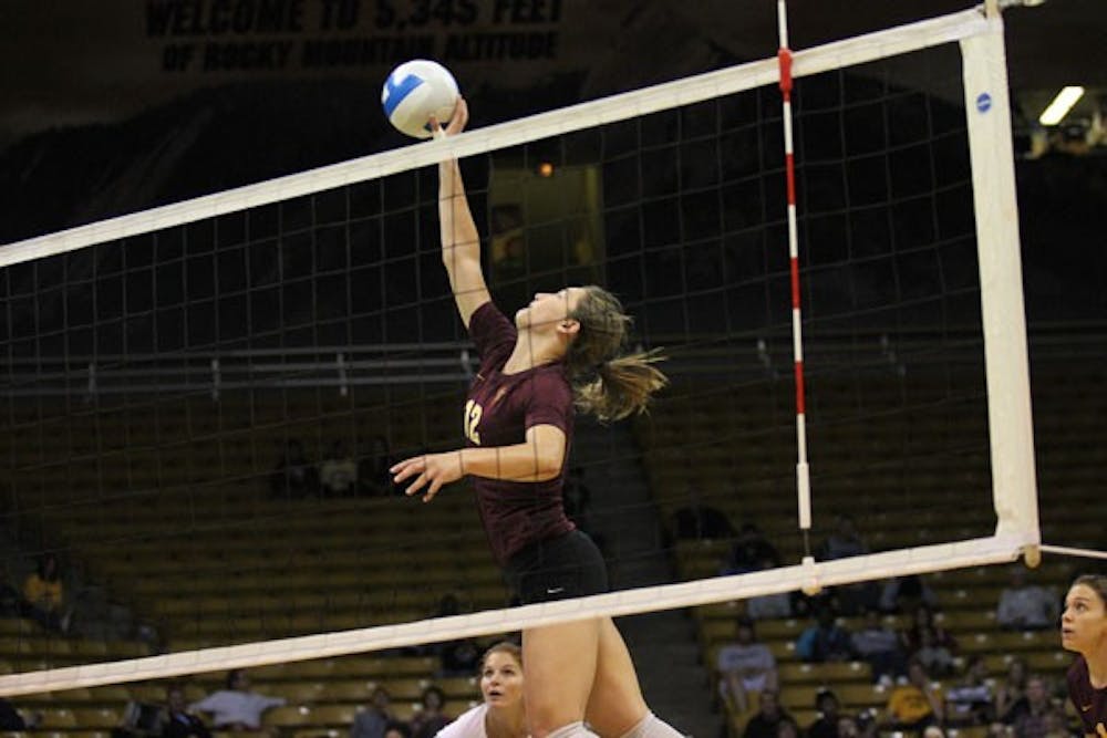 Freshman outside hitter Macey Gardner taps the ball over the net during the Sun Devils’ 3-2 loss at Colorado on Oct. 12. (Photo by Kyle Newman)