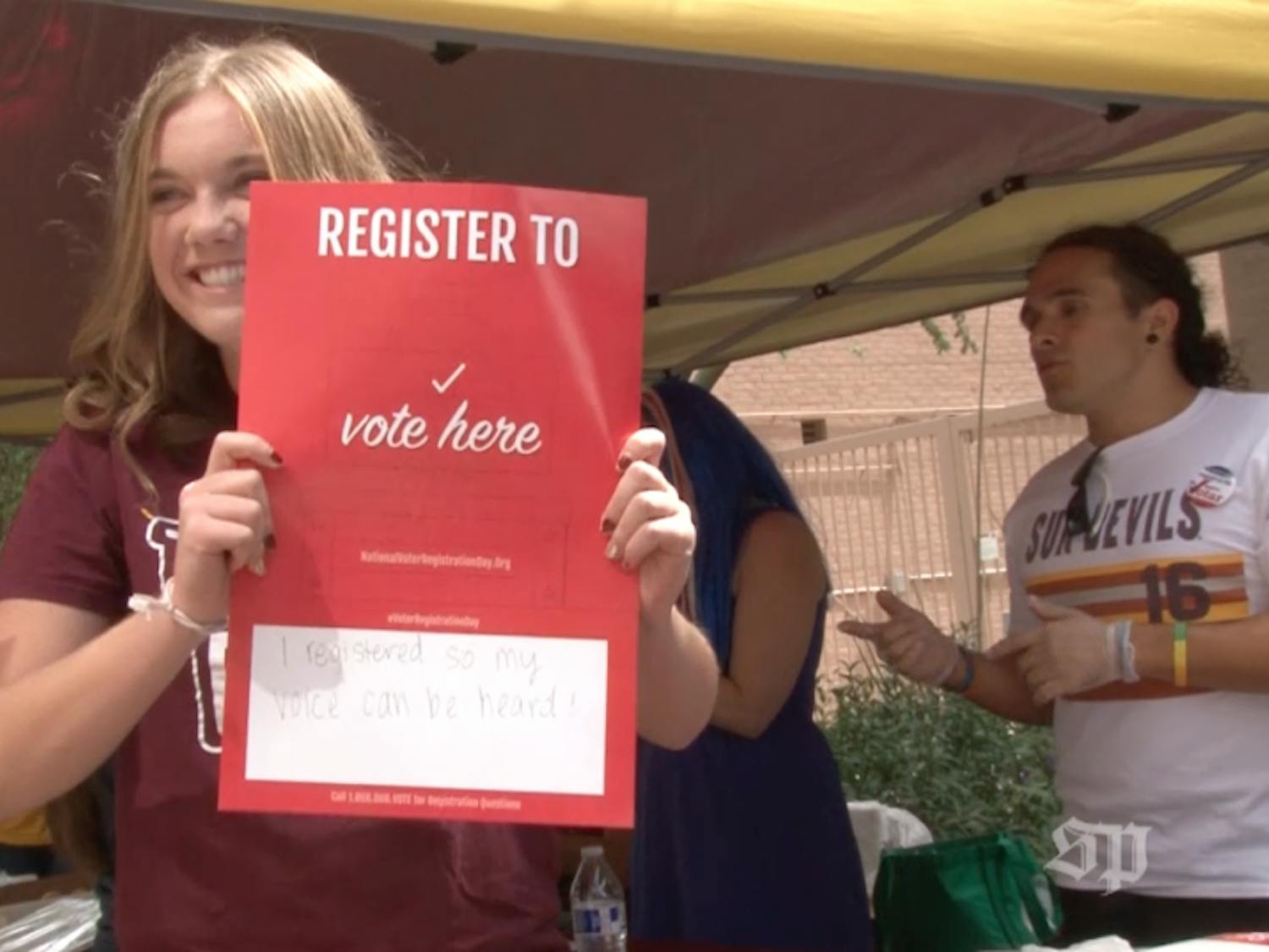 A student registers to vote on the downtown Phoenix campus.