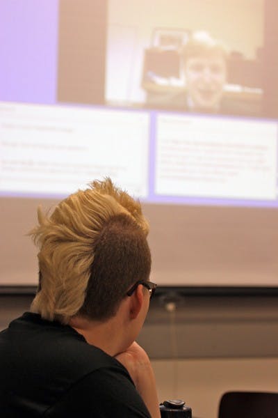 ASK AND TELL: ASU LGBQTA Coalition community relations director Emily Johnson watches a live webcast of Obama's campaign manager Jim Messina to celebrate the repeal of  “Don't Ask, Don't Tell” policy Tuesday afternoon in the Memorial Union. (Photo by Lisa Bartoli)