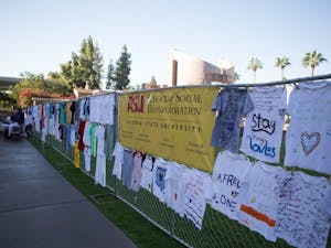 T-shirts with heartwarming messages that are part of the Clothesline Project are displayed at Hayden Lawn. The purpose of the project is to increase awareness and break the silence that often surrounds these experiences. (Photo by Ryan Liu)