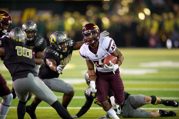 UPSET BID FAILED: ASU junior wide receiver Jamal Miles runs to the outside during Oregon’s 41-27 win on Saturday. The Sun Devils scored 14 points in the first quarter, but had trouble moving the ball downfield in the second half. (Photo courtesy of Michael Arellano)