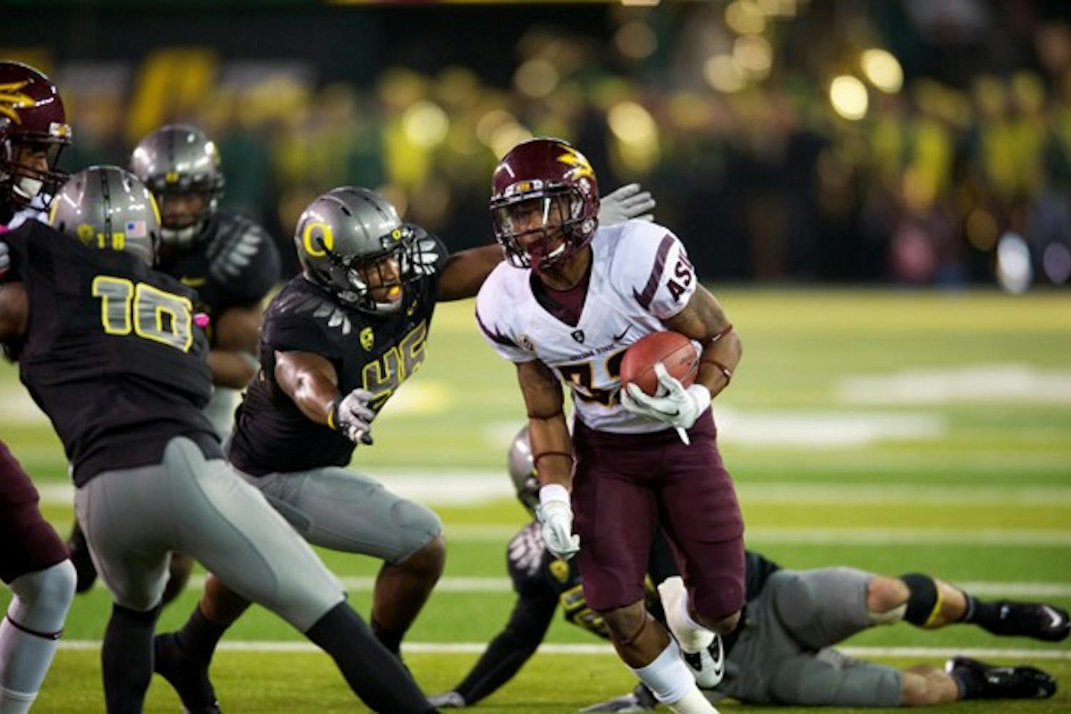 UPSET BID FAILED: ASU junior wide receiver Jamal Miles runs to the outside during Oregon’s 41-27 win on Saturday. The Sun Devils scored 14 points in the first quarter, but had trouble moving the ball downfield in the second half. (Photo courtesy of Michael Arellano)