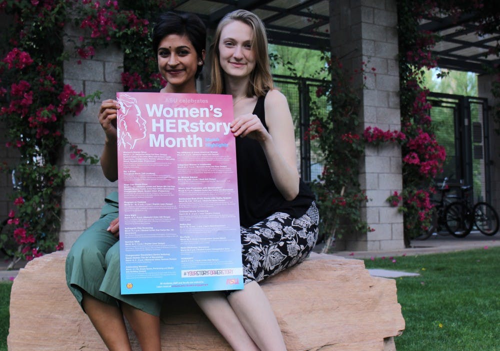 Students Asha Ramakumar and Rachel Fletcher pose with a poster about women's events at ASU on March 21, 2017.