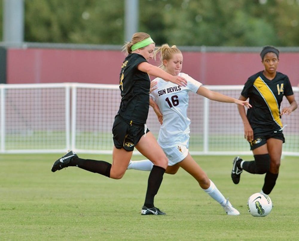 PROTECT THIS HOUSE: Sophomore midfielder Blair Alderson (16) winds up for a kick away from Missouri junior midfielder Haley Krentz during the Sun Devils’ 1-0 loss to the Tigers on Sept. 11. ASU returns to Sun Devil Soccer Stadium on Friday for the first time in 26 days for a homestand against No. 19 Oregon State and Oregon. (Photo by Aaron Lavinsky)