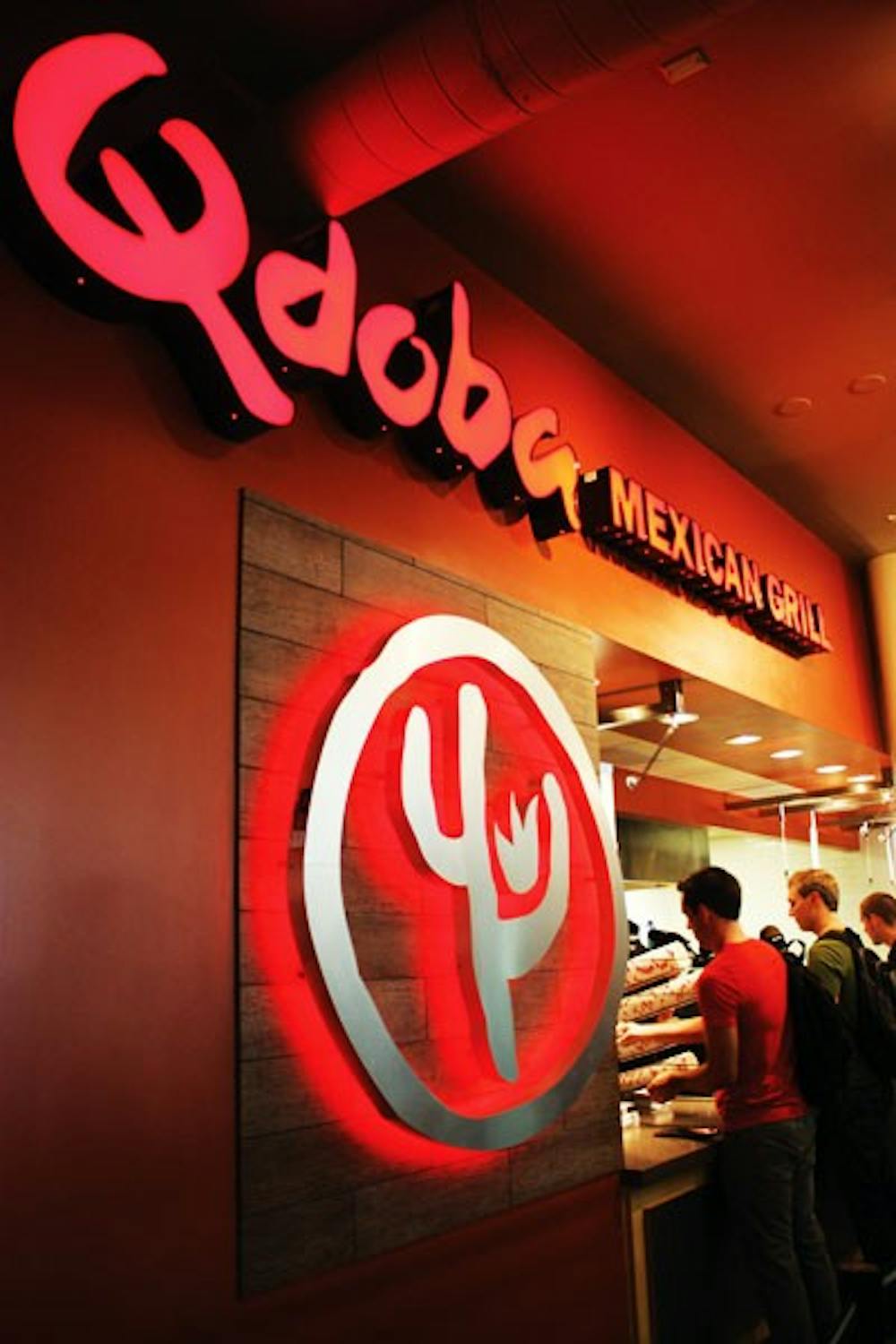 Students line up at the newly opened restaurant, Qdoba Mexican Grill, in the Memorial Union on Tuesday afternoon. (Photo by Cameron Tattle)