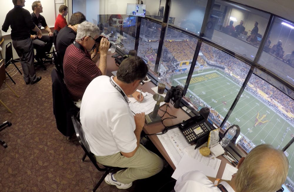 Members of the stat crew in the press box work during an ASU football game against Northern Arizona University on Saturday, Sept. 4, 2016.&nbsp;