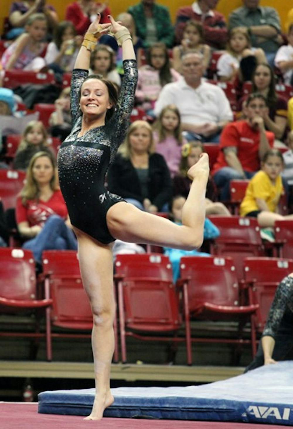 Brianna Gades performs a floor routine in a meet against Utah on Feb. 12. Gades scored a career high of 9.850 on the balance beam. (Photo by Beth Easterbrook)