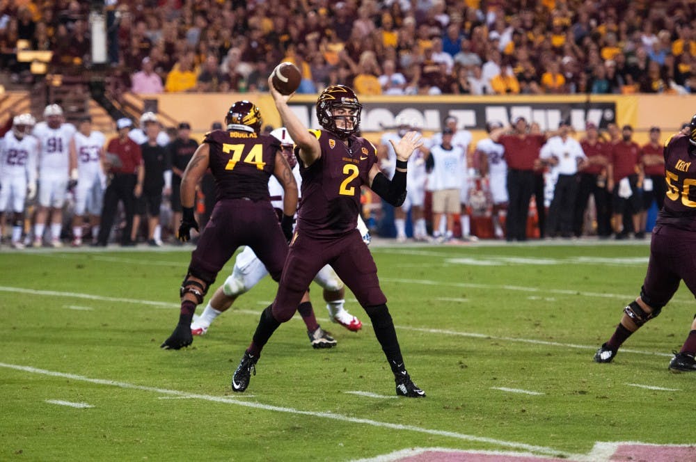 Redshirt junior quarterback Mike Bercovici passes to an open teammate. ASU beat Standford 26-10 at Sun Devil Stadium on Saturday Oct. 8, 2014. (Photo by Mario Mendez)