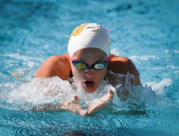 Rebecca Ejdervik swims the breaststroke in a meet against UA Feb. 11. Ejdervik and Elina Eggers both took home conference championships last weekend in Federal Way, Wash. (Photo by Aaron Lavinsky)