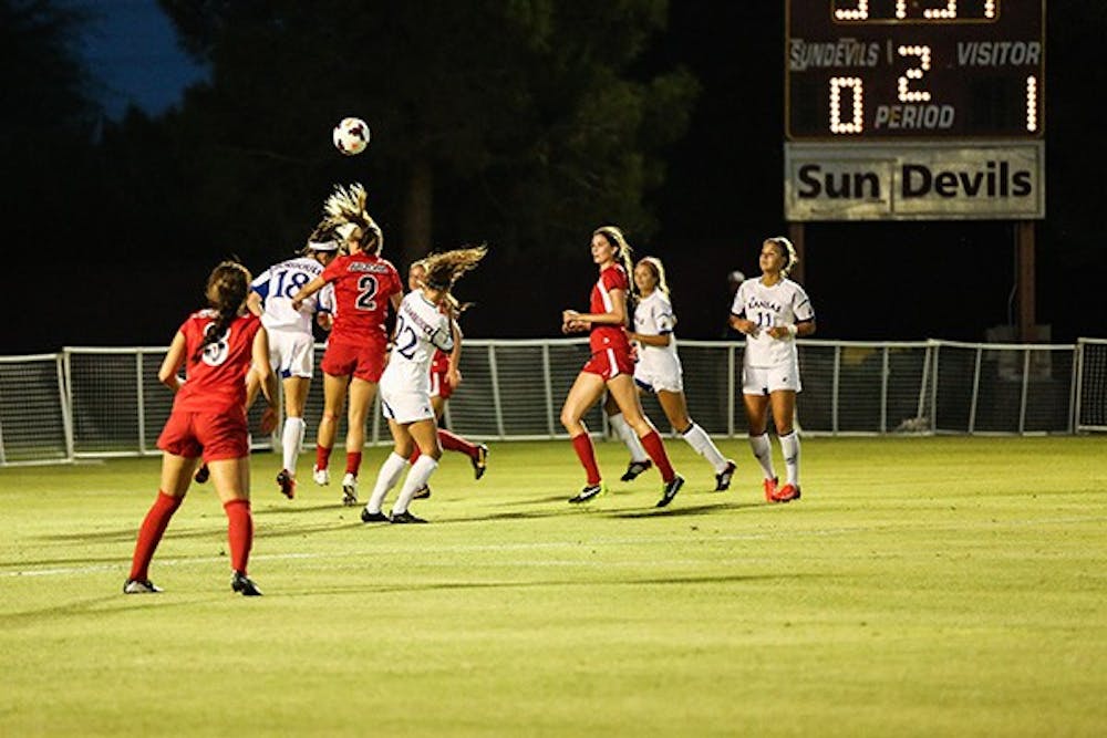 Ali Doller heads the ball during the game against Kansas at the Sun Devil Tournament. Doller used to play for ASU.