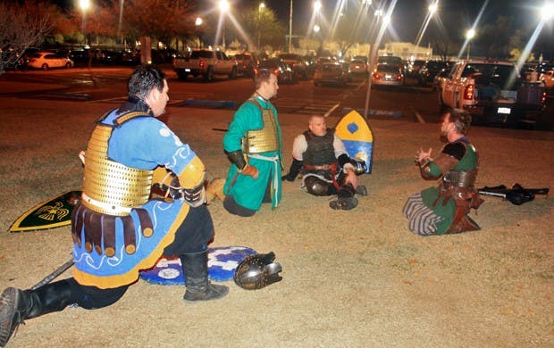 Knight Barron Morgan kneels in front of other soldiers before the next practice battle begins. Photo by Noemi Gonzalez.