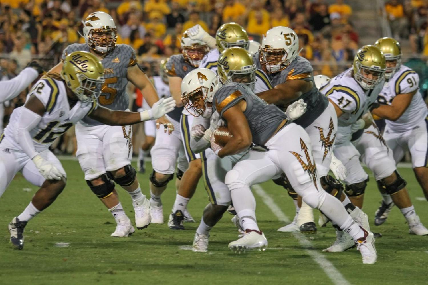 Demario Richard runs for a first down at the ASU Vs. UCLA footbal game on Oct. 8, 2016.