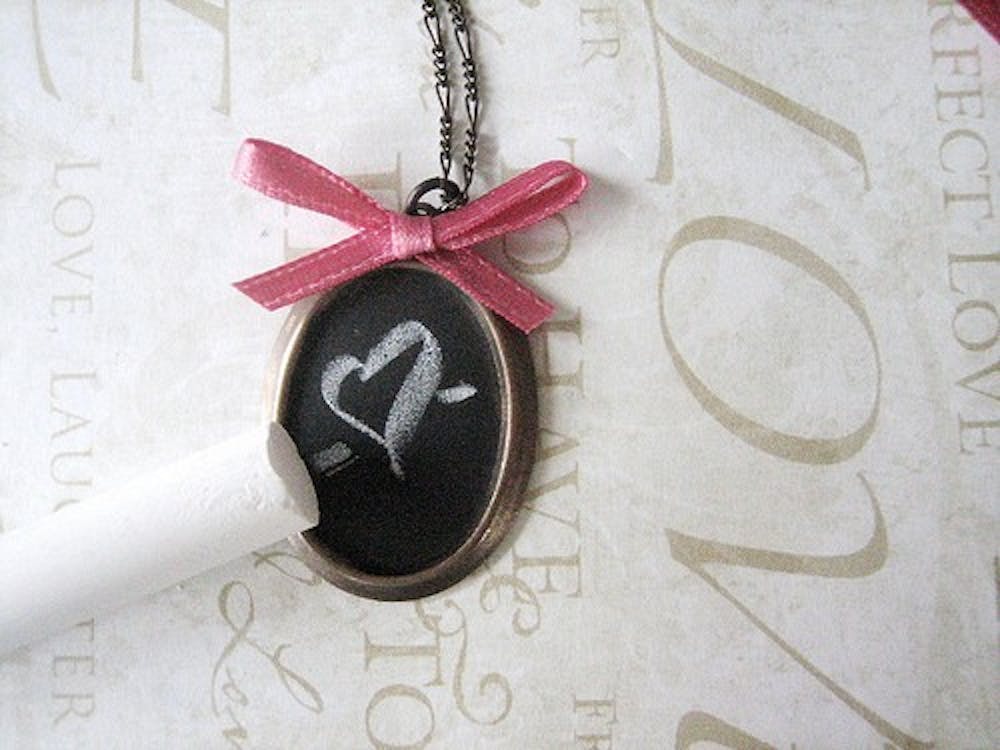 Paint a pendant using chalkboard paint to create a unique necklace. Photo from the Henry Happened blog.