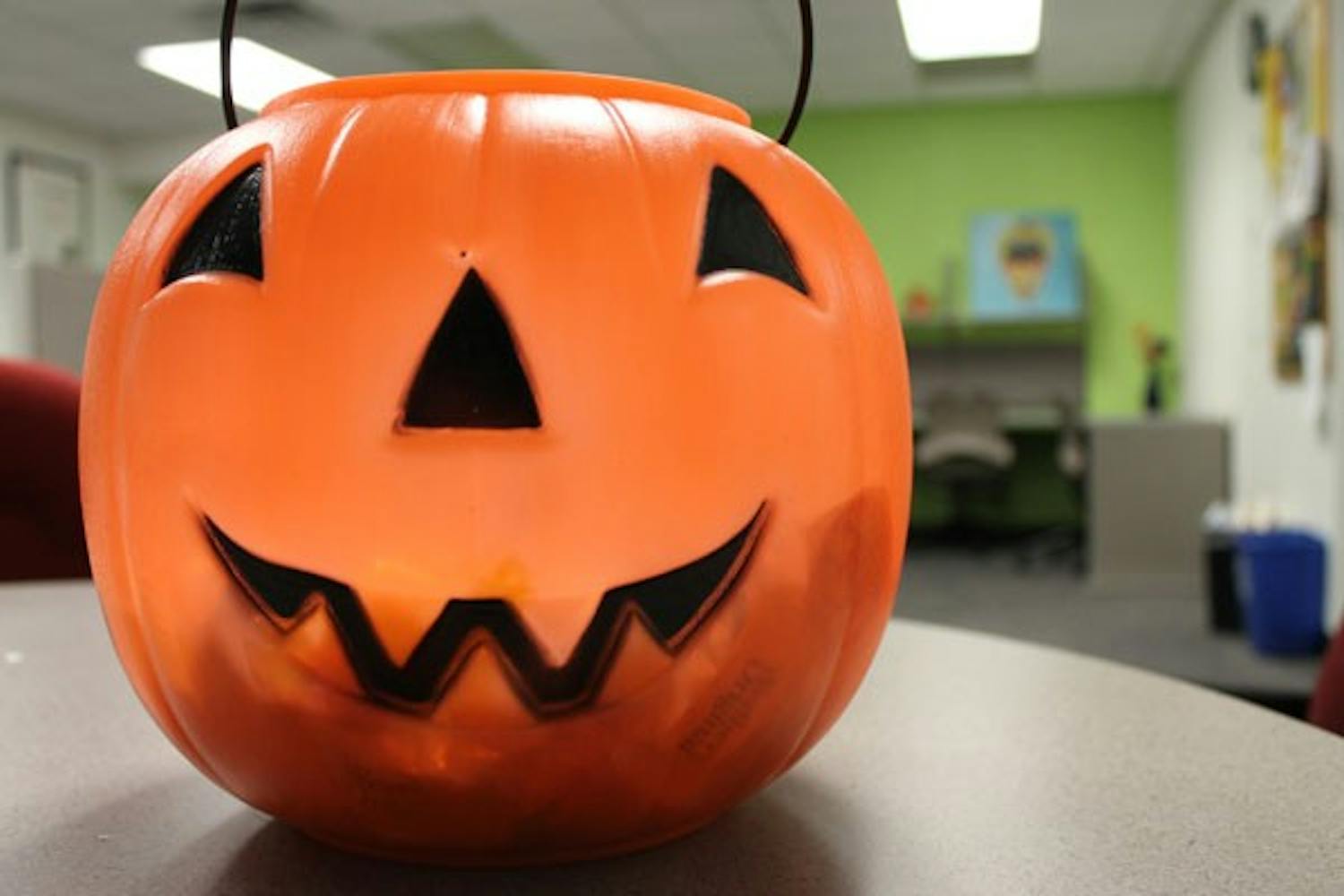 A Halloween pumpkin filled with candy in the Interdisciplinary B Building satisfies students' sweet tooth Tuesday afternoon. (Photo by Robin Kiyutelluk)