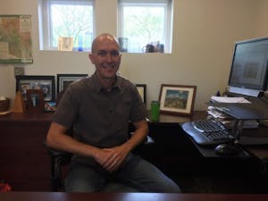 Robert Monahan poses in his office at the Sonora Center on ASU's Tempe campus on Monday, April 3.