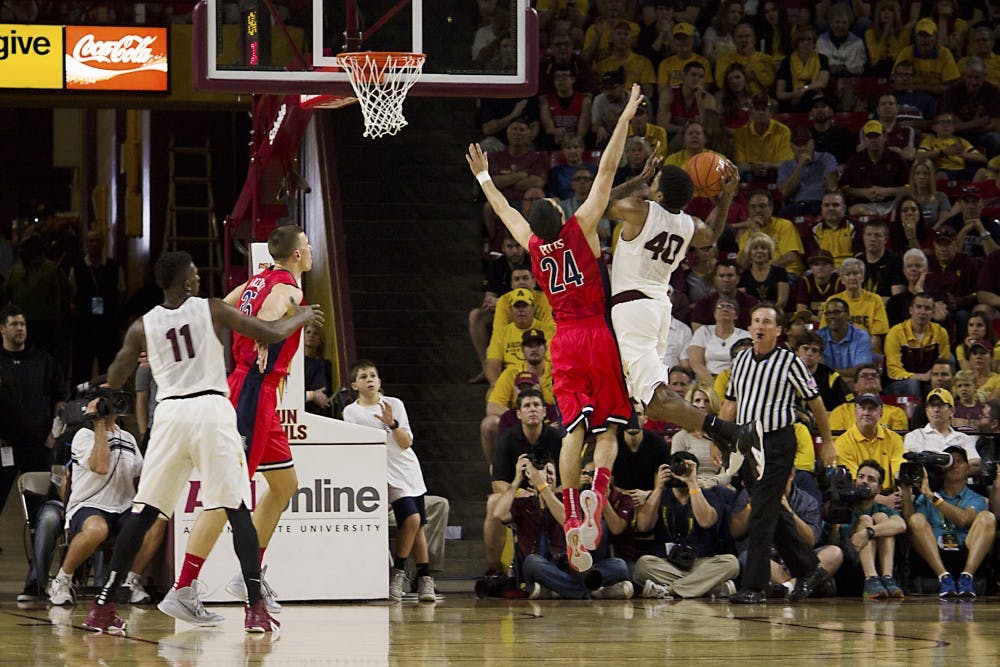 ASU senior Shaquielle McKissic goes for the basket as the Sun Devils clash with No. 6 Arizona on Feb. 7, 2015, at Wells Fargo Arena in Tempe. The Sun Devils beat Arizona 81-78 in the closely fought home game. (Shiva Balasubramanian/ The State Press)