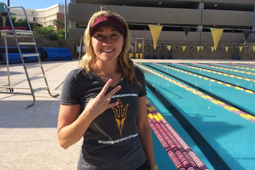 Misty Hyman poses for a photo on the pool deck of the Mona Plummer Aquatic Center in Tempe, Arizona.