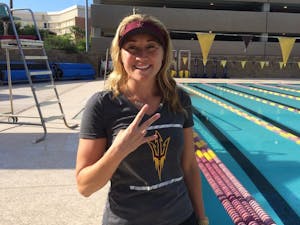 Misty Hyman poses for a photo on the pool deck of the Mona Plummer Aquatic Center in Tempe, Arizona.