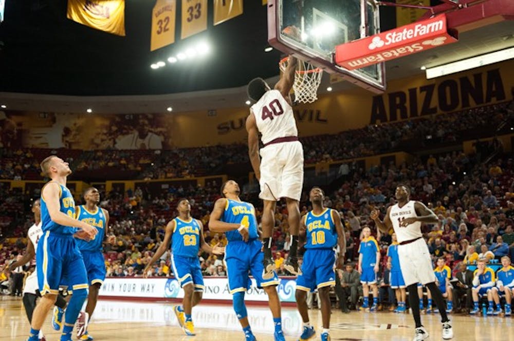 Senior forward Shaquielle McKissic dunks the ball in a game against UCLA on Wednesday, Feb. 18, 2015, at Wells Fargo Arena in Tempe. The Sun Devils defeated the Bruins 68-66. (Ben Moffat/The State Press)