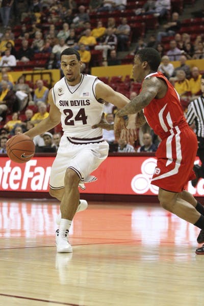 Trent Lockett dribbles the ball in the paint in a game against Utah Feb. 9. Lockett’s ankle continues to improve, but coach Herb Sendek is unsure if it will be completely healed this season. (Photo by Sam Rosenbaum)