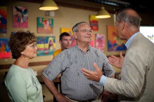 AWAITING RESULTS: Campaign volunteers for Harry Mitchell set up outside Dave's Brewing Pub on Tuesday in anticipation of the Congressman's appearance at the viewing party for nationwide Congressional primary results. (Photo by Michael Arellano)