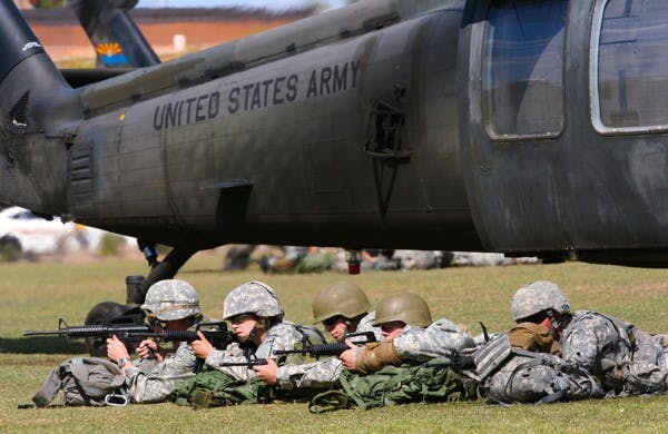 LANDING ZONE: ASU ROTC cadets perform a simulation raid Saturday at the SRC fields in Tempe.  ASU is now providing military veterans with priority class registration.  (Photo by Lisa Bartoli)