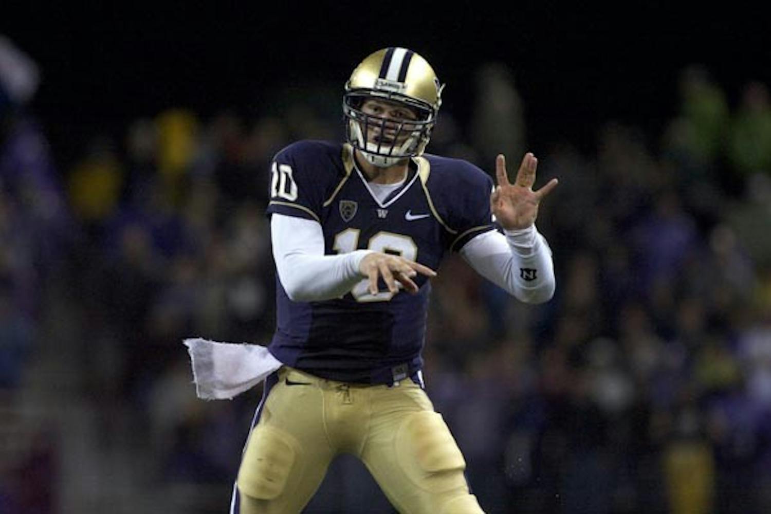 TOP DAWG: UW senior quarterback Jake Locker holds up a "W" after a big play against ASU on Saturday. Locker's running ability was limited in the game, which the Huskies lost 24-14. (Photo by Scott Stuk)