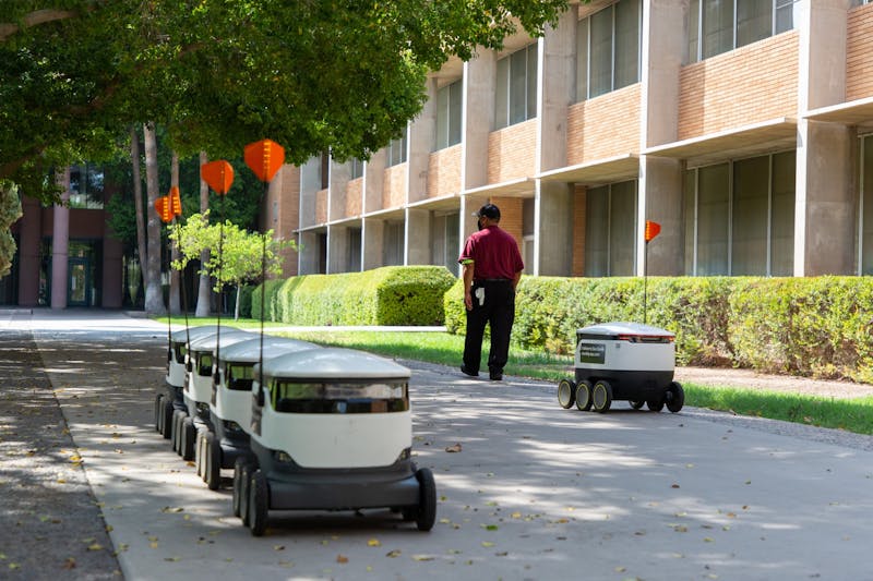 ASU food delivery robots are stationed in front of each other after delivering food on the Tempe campus on Friday, Aug. 28, 2020.