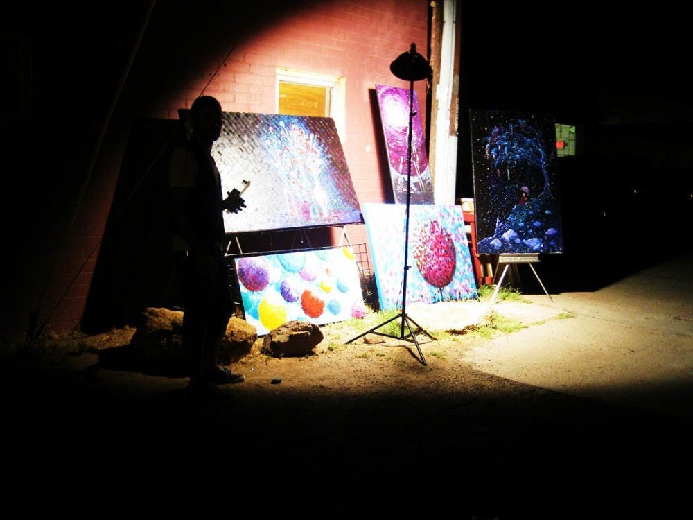 Artists present their art in the street. Photo by Faith Breisblatt. 