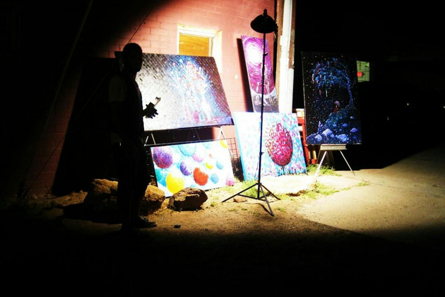 Artists present their art in the street. Photo by Faith Breisblatt.