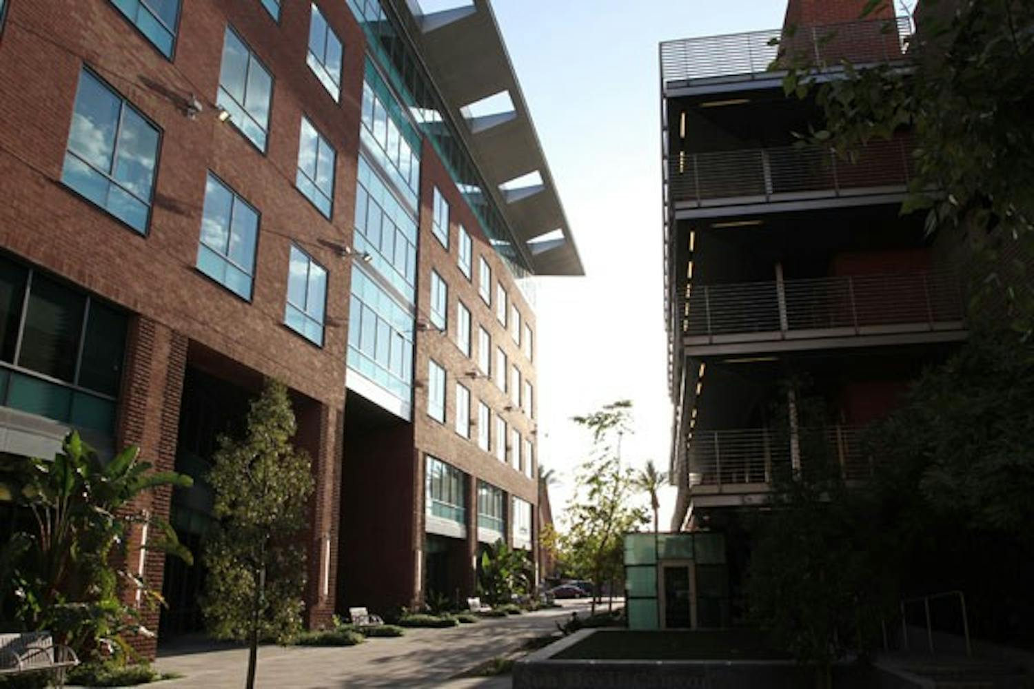 SINKING SUN: The setting sun tries to shine through the corridor located between the Foundation building and the Foundation parking garage. (Photo by Nikolai de Vera)