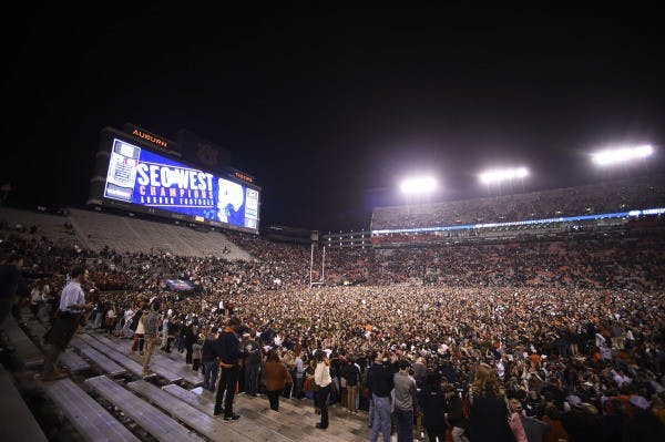 ​Auburn fans storm the field following Auburn's win over Alabama.