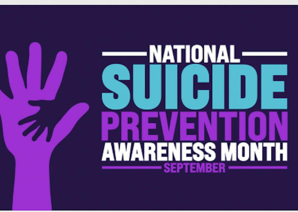 Purple awareness graphic featuring overlapping adult and child hand silhouettes beside the words “National Suicide Prevention Awareness Month — September” in blue, purple and white lettering.