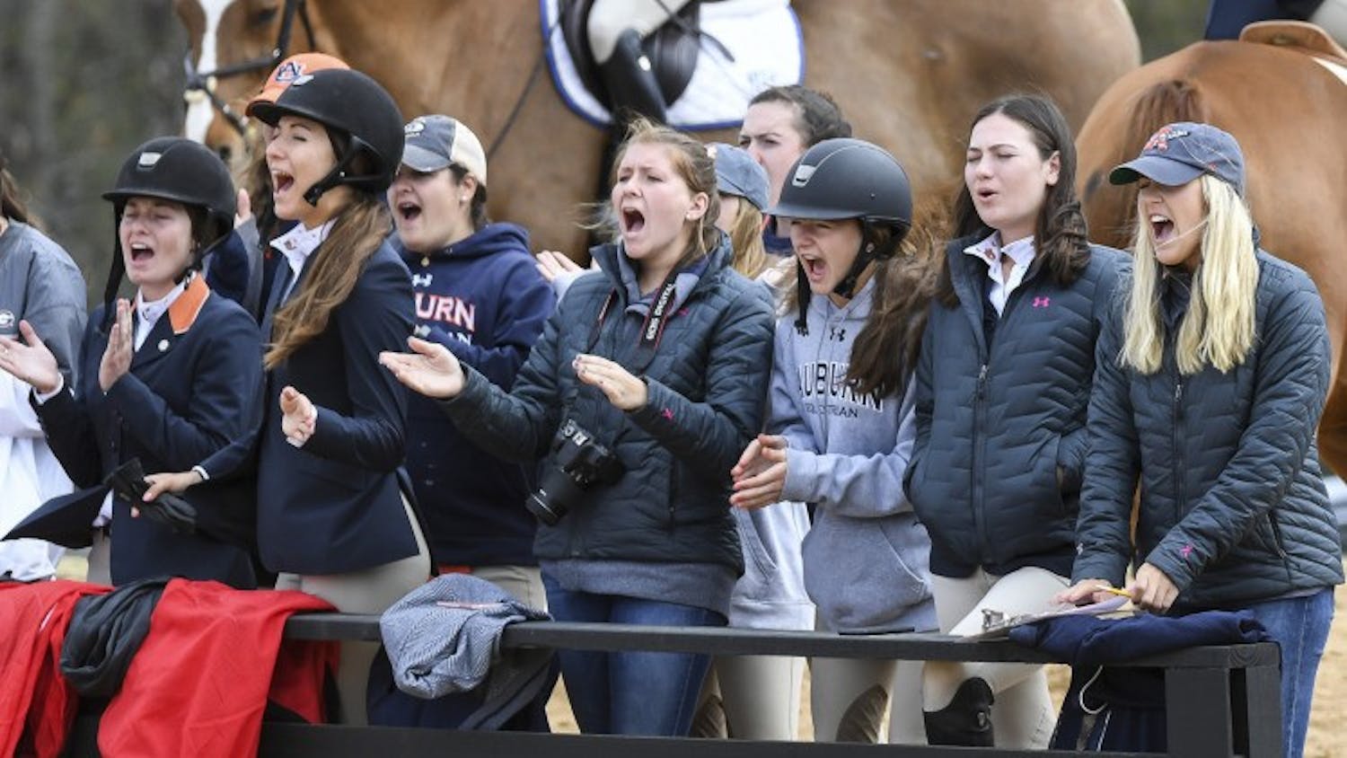Auburn equestrian team cheers on each other. ​